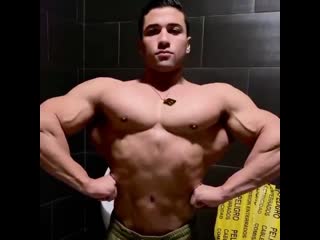 enri- just another incredibly hot muscle hunk hanging out in the bathroom and flexing.